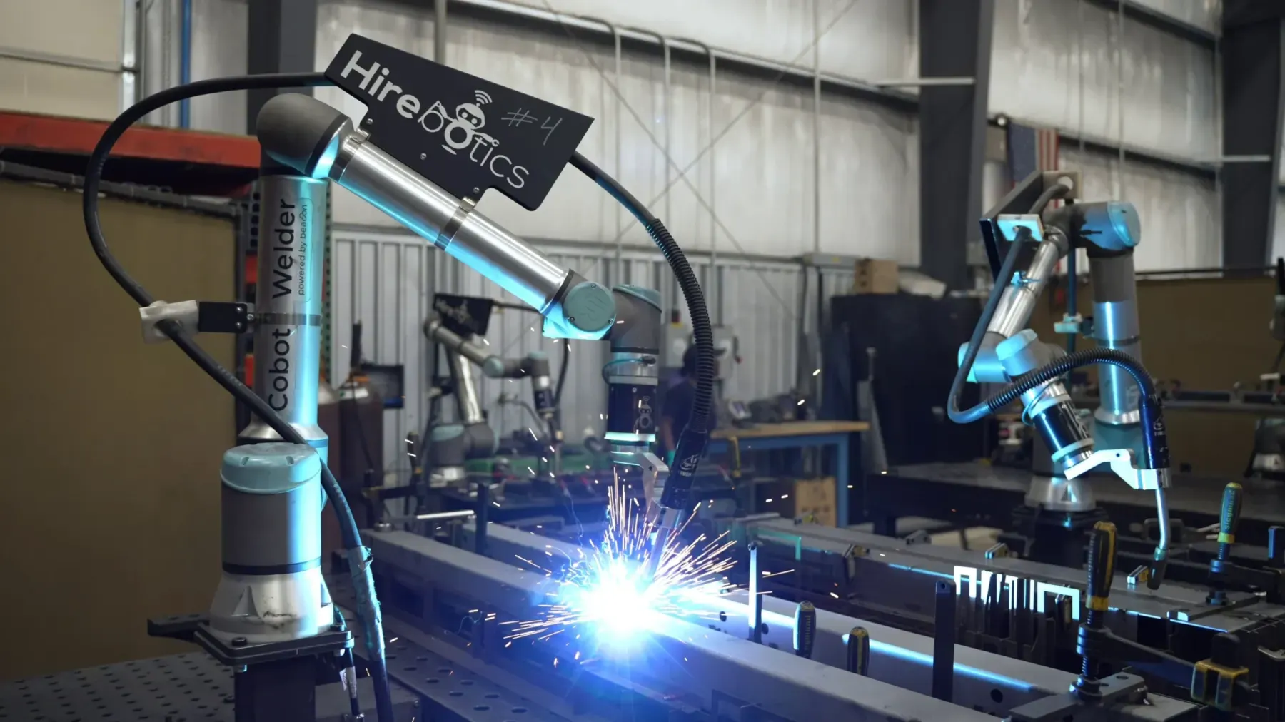 Four welding cobots on the floor at Athena Manufacturing