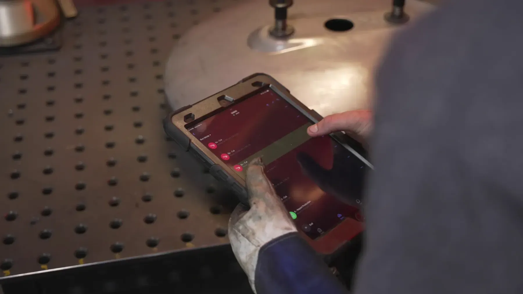Operator programming a cobot from the Beacon app on a phone