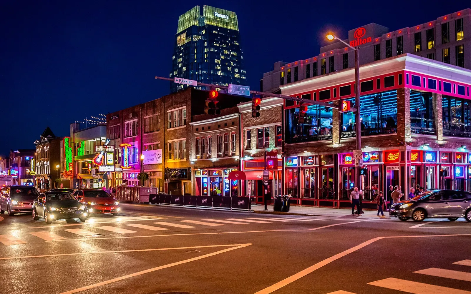 Neon signs and honky-tonks on Lower Broadway in Nashville at night