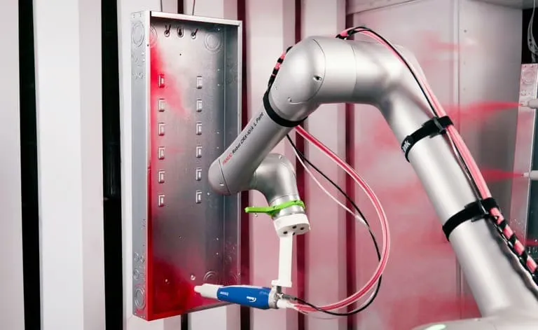 Cobot Painter working inside an existing manual paint booth