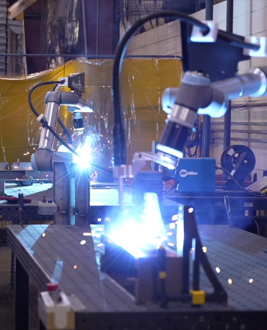 two-cobot-welder-in-action-welding-vertical