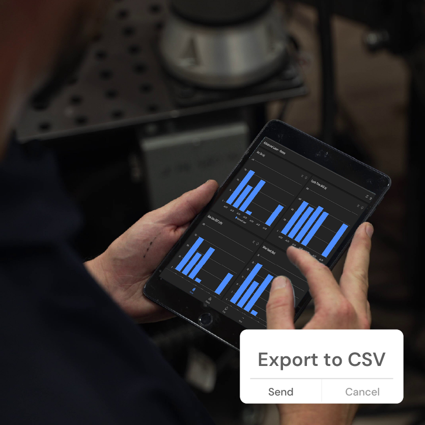 Fabricator holding tablet in front of Hirebotics Cobot, looking at performance data. Bottom right icon shows the ability to Export to CSV and view data in other apps outside of Beacon for full control of your shop performance data