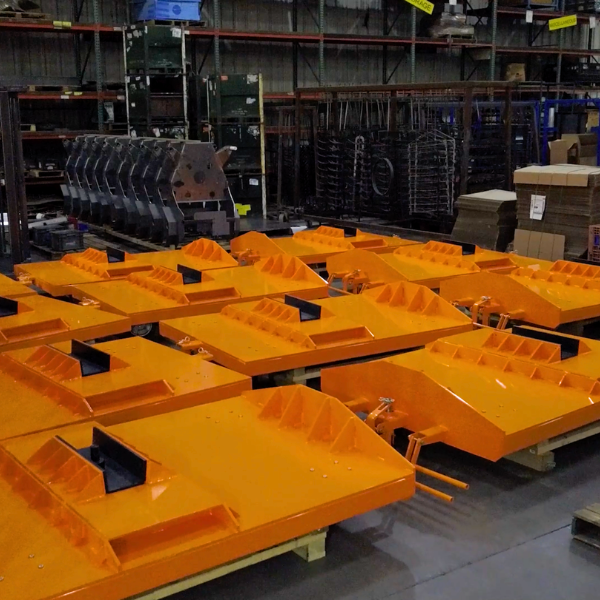 Huncilman lead welder with weld mask next to Hirebotics Cobot Welder