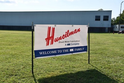 Huncilman | Custom Sheet Metal Fabrication Services | Outdoor sign at facility