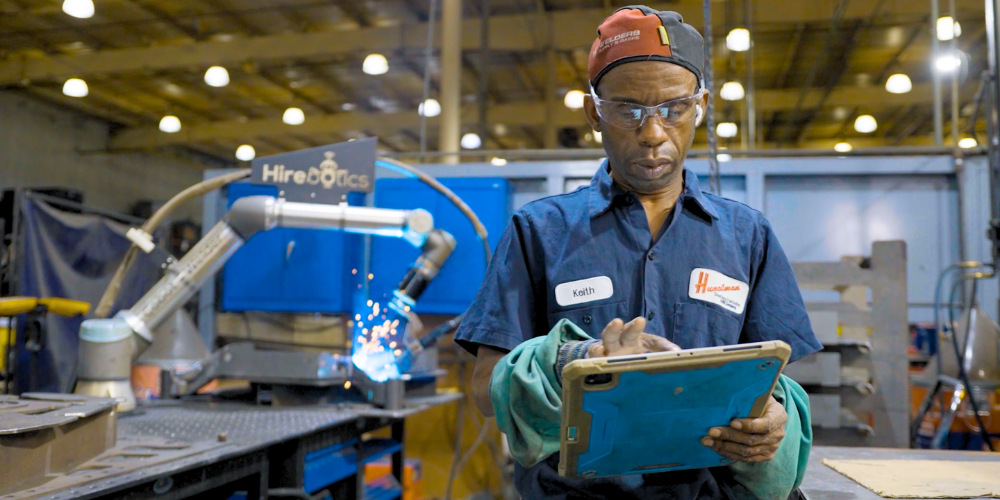 Huncilman Cobot Welder case study welder using Beacon on tablet
